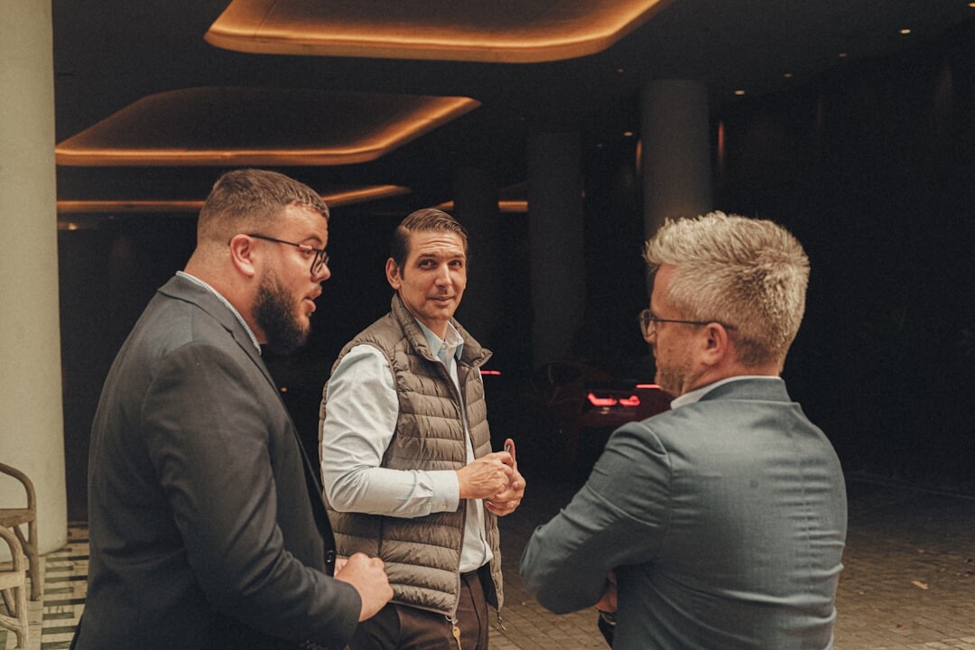 Business professionals networking and shaking hands at an event